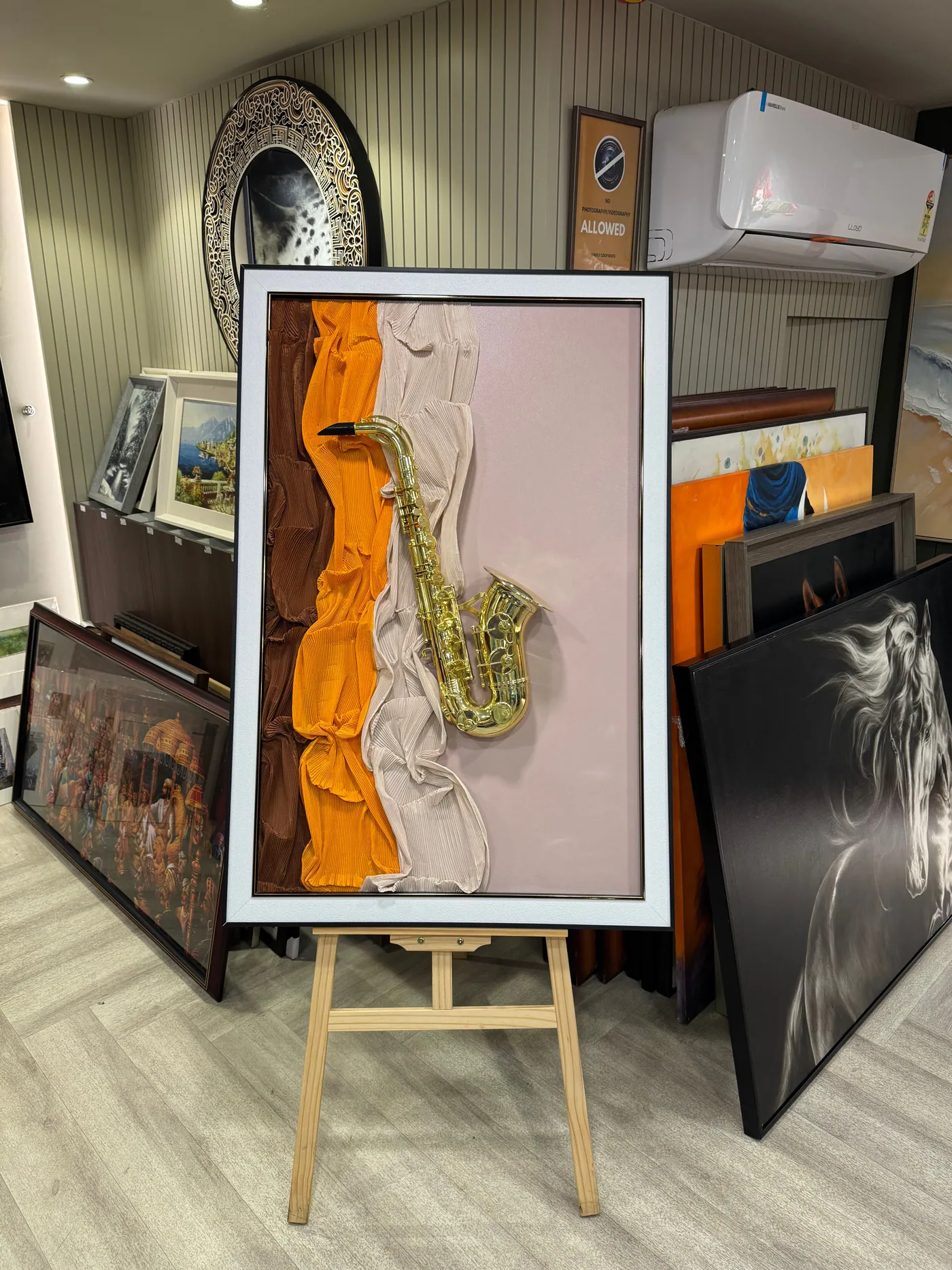 A framed work on an easel in the Neeha Arts showroom